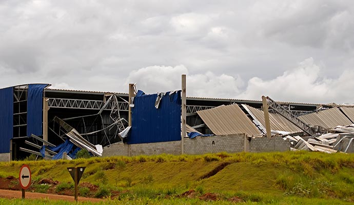 A large industrial building with significant structural damage