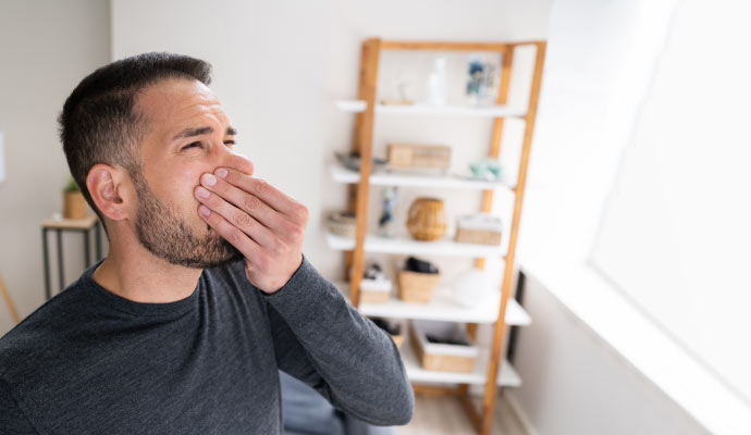 A man suffering from smoke odors