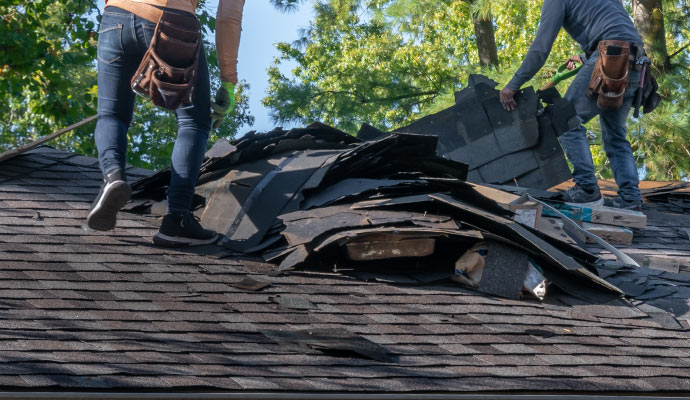 Person repairing the damaged roof